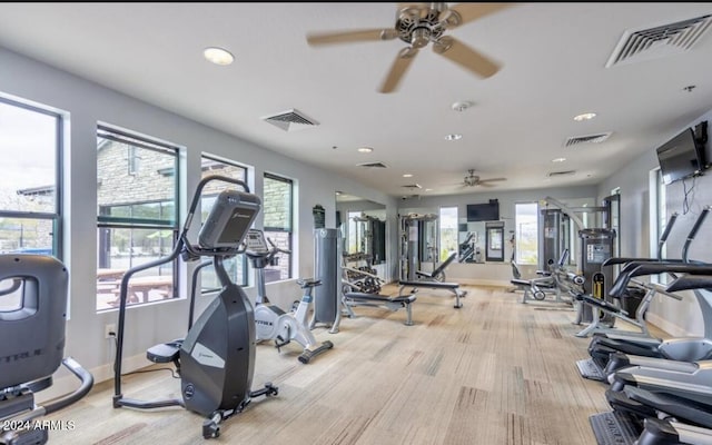 gym with ceiling fan and plenty of natural light