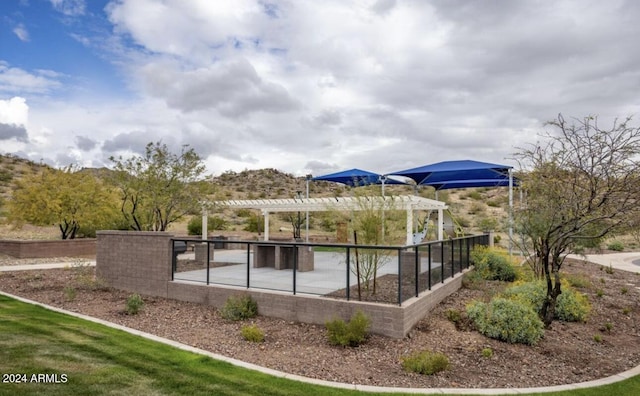 view of swimming pool with a pergola