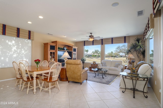 living room with ceiling fan and light tile patterned floors