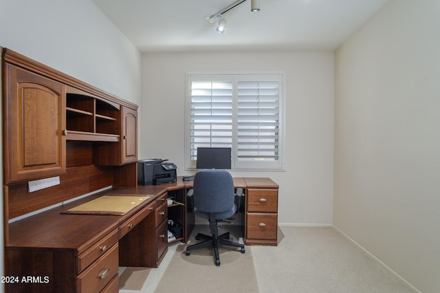 office area with light colored carpet and rail lighting