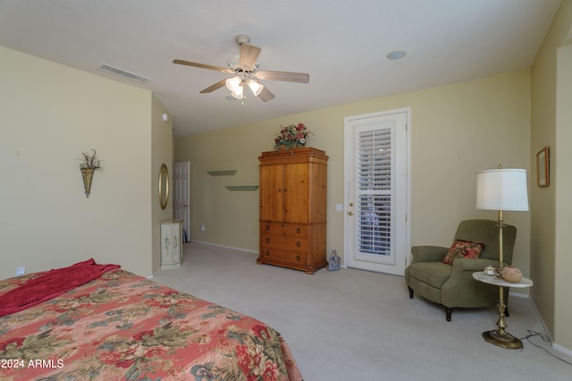 carpeted bedroom with ceiling fan and access to outside