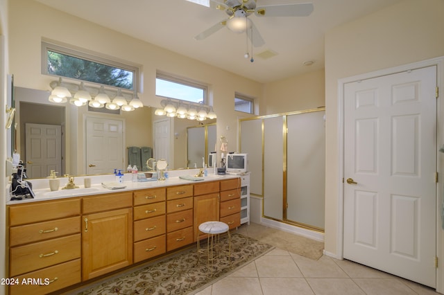 bathroom with walk in shower, vanity, and a wealth of natural light