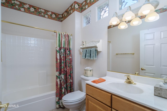 full bathroom with vanity, toilet, and shower / bath combo with shower curtain