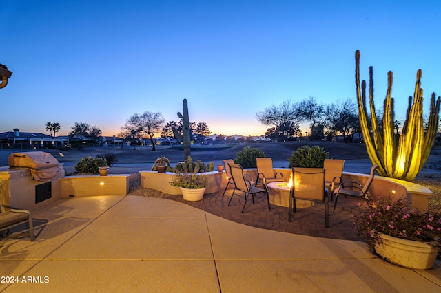 view of patio terrace at dusk