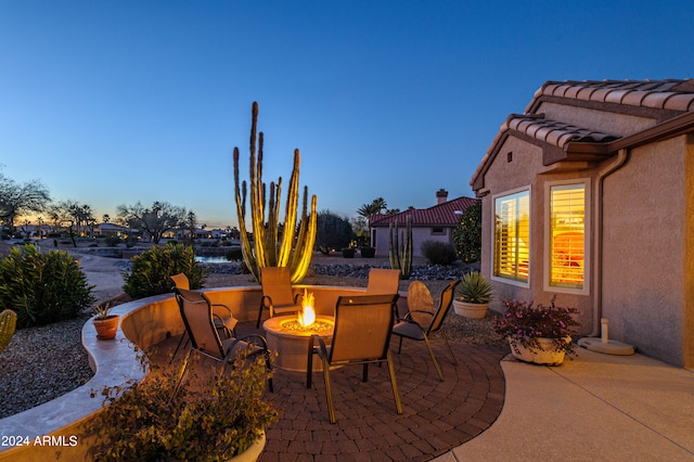 view of patio terrace at dusk