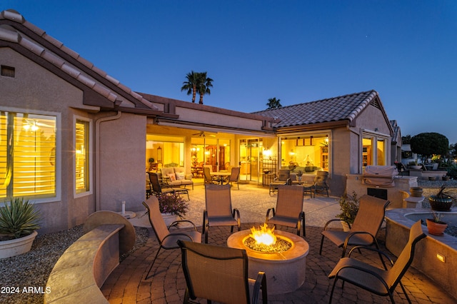 patio terrace at dusk with a fire pit