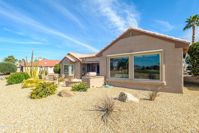 rear view of property with a patio