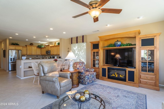 living room featuring light tile patterned flooring and ceiling fan