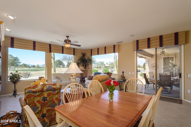 tiled dining room with ceiling fan