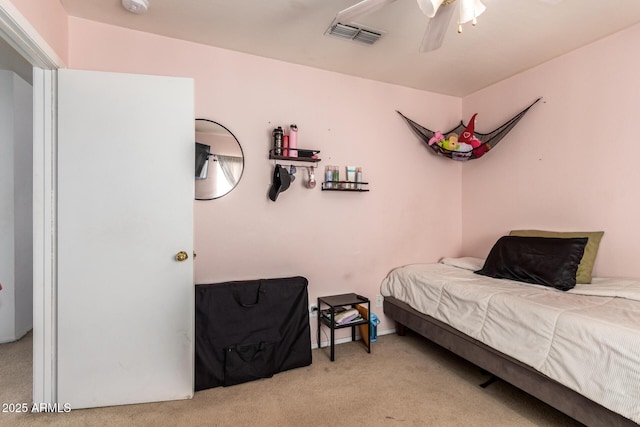 bedroom featuring ceiling fan and light colored carpet