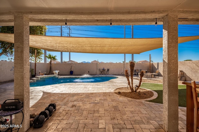 view of pool with pool water feature and a patio