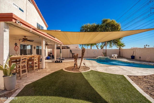 view of pool featuring ceiling fan and a patio area