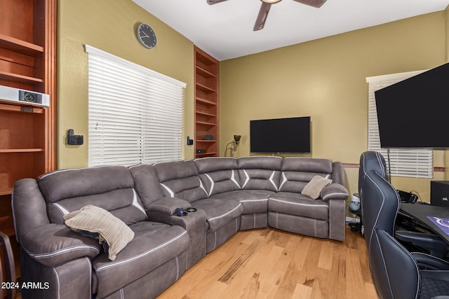 living room featuring hardwood / wood-style flooring and ceiling fan