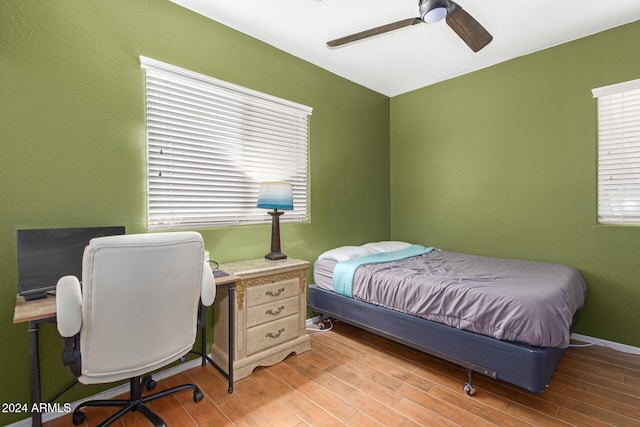 bedroom featuring ceiling fan and light hardwood / wood-style flooring