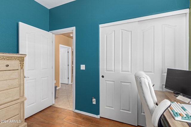 unfurnished office with wood-type flooring