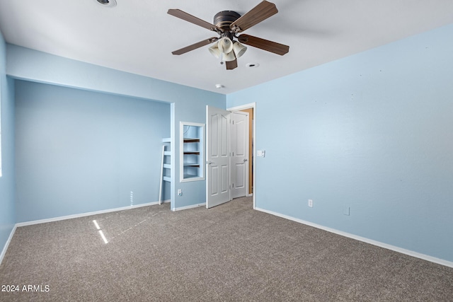 unfurnished bedroom featuring carpet and ceiling fan