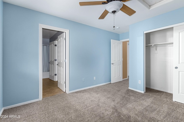 unfurnished bedroom with a closet, light colored carpet, and ceiling fan