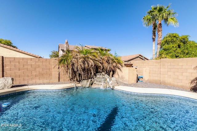 view of pool with pool water feature