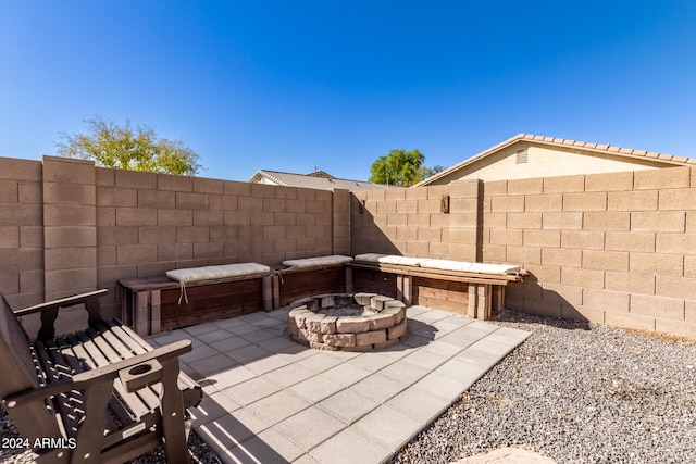 view of patio featuring an outdoor fire pit