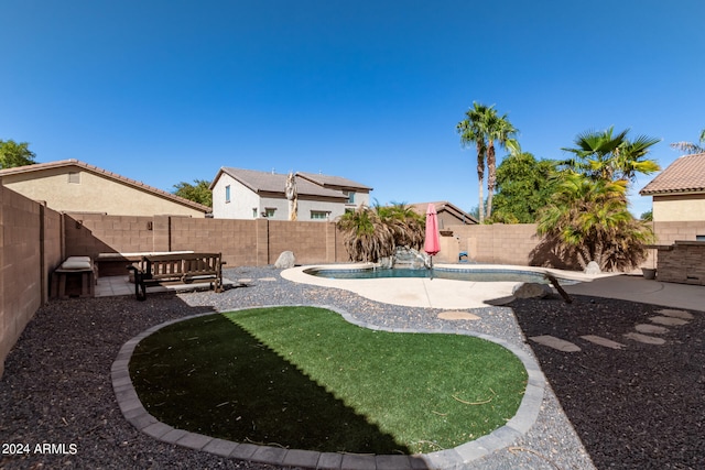 view of yard featuring a patio and a fenced in pool