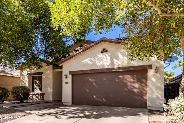 mediterranean / spanish-style house featuring a garage