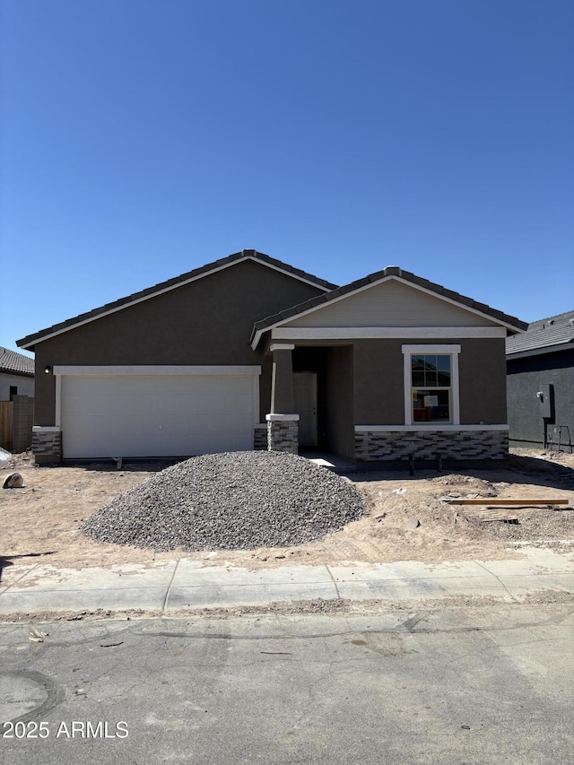 6057 E Artemis Dr, Florence, AZ 85132 - ranch-style house featuring a garage, stucco siding, and stone siding