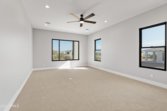 carpeted empty room with ceiling fan