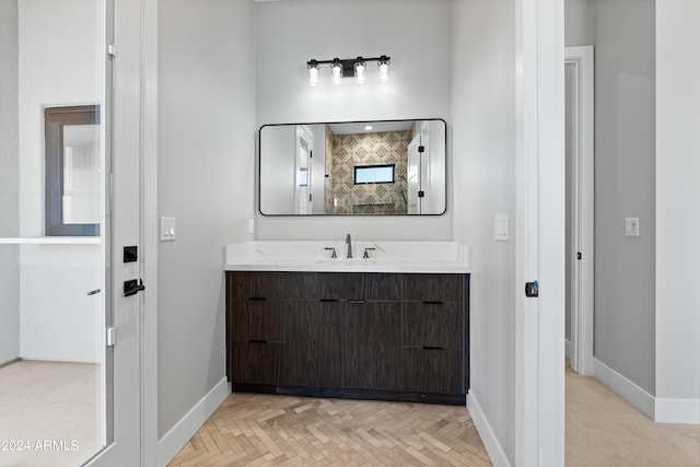 bathroom featuring vanity and parquet floors