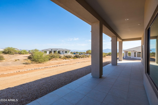 view of patio / terrace featuring a mountain view