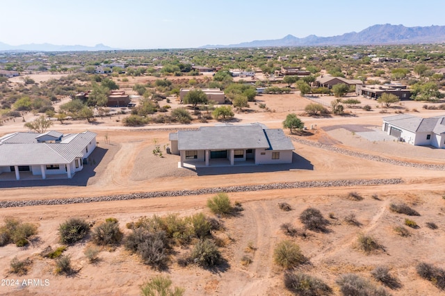 birds eye view of property featuring a mountain view