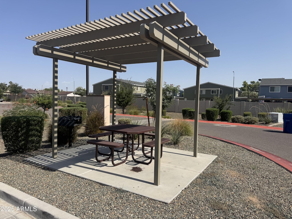 2339 E University Dr Unit 19, Mesa, AZ 85213 - view of patio / terrace with a pergola and a residential view