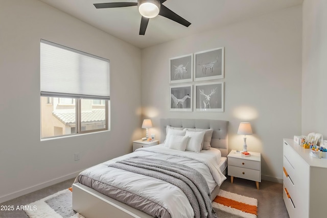 carpeted bedroom with baseboards and ceiling fan