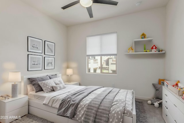 bedroom featuring baseboards, carpet, and ceiling fan