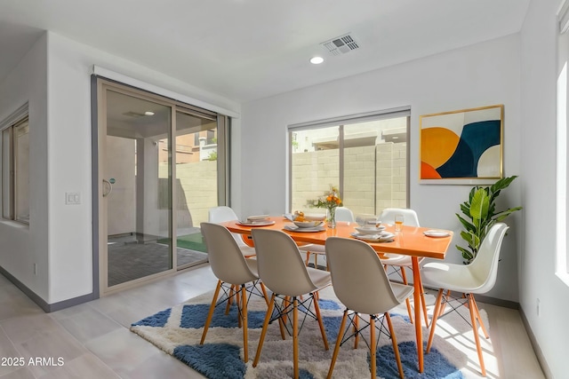 dining area with baseboards, recessed lighting, and visible vents