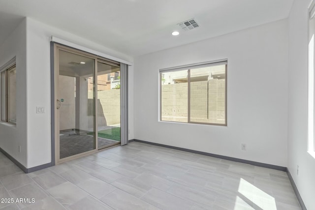unfurnished room featuring baseboards, recessed lighting, and visible vents