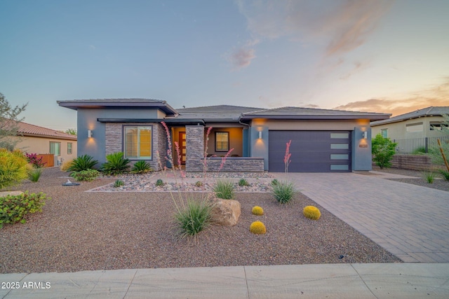 17565 E Blaze Ln, Rio Verde, AZ 85263 - prairie-style home with a porch, a garage, stucco siding, and decorative driveway