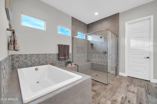 17565 E Blaze Ln, Rio Verde, AZ 85263 - bathroom featuring a garden tub, a stall shower, wood finished floors, and recessed lighting