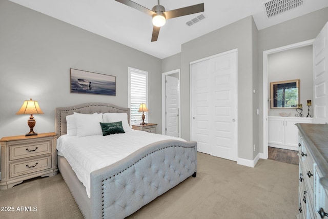 17565 E Blaze Ln, Rio Verde, AZ 85263 - bedroom with light colored carpet, a closet, baseboards, and a ceiling fan