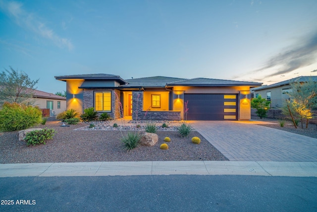 17565 E Blaze Ln, Rio Verde, AZ 85263 - prairie-style home with an attached garage, stone siding, driveway, and stucco siding