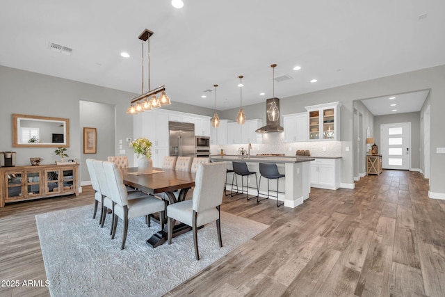 17565 E Blaze Ln, Rio Verde, AZ 85263 - dining area with light wood-style floors, recessed lighting, and baseboards