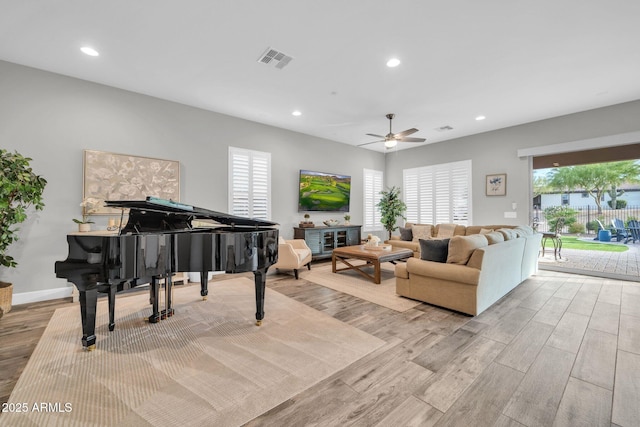 17565 E Blaze Ln, Rio Verde, AZ 85263 - living room with light wood-style flooring, ceiling fan, and recessed lighting