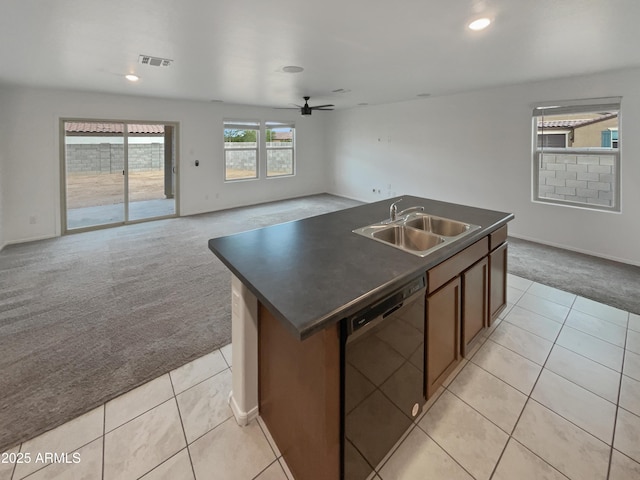 kitchen with light carpet, black dishwasher, visible vents, dark countertops, and a sink