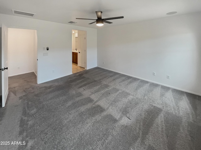 unfurnished bedroom with carpet floors, visible vents, and baseboards