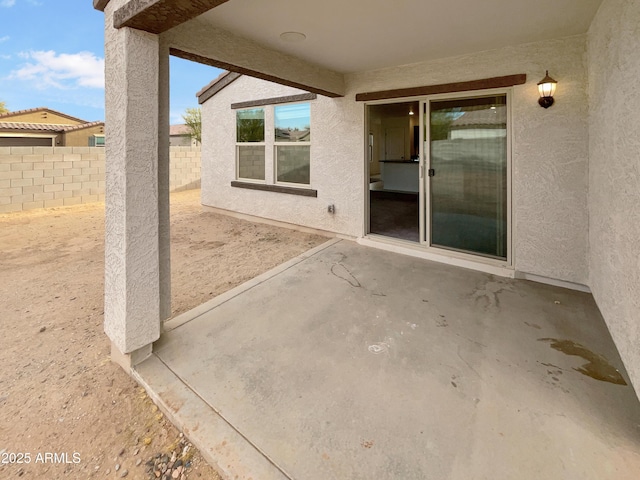 view of patio / terrace featuring fence