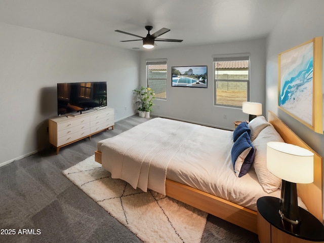 bedroom featuring a ceiling fan, carpet, and baseboards