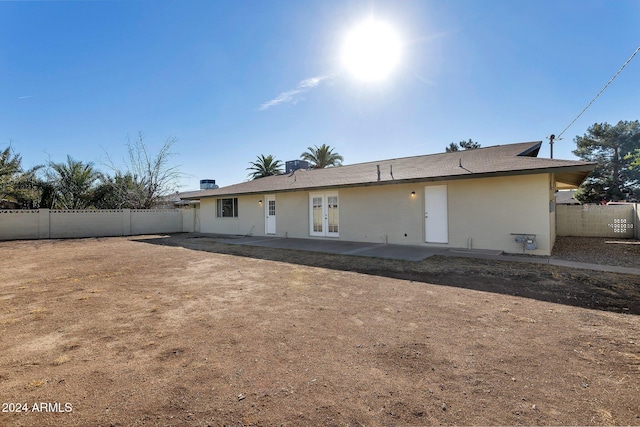 rear view of house with a patio and french doors