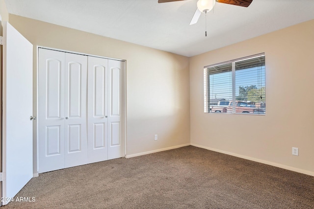 unfurnished bedroom featuring carpet, a closet, and ceiling fan