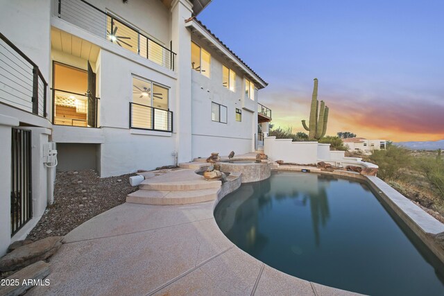 15641 E Sycamore Dr, Fountain Hills, AZ 85268 - pool at dusk featuring a pool with connected hot tub