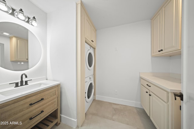 15641 E Sycamore Dr, Fountain Hills, AZ 85268 - laundry room with stacked washing machine and dryer and baseboards
