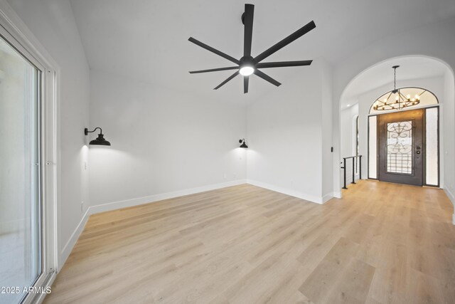 15641 E Sycamore Dr, Fountain Hills, AZ 85268 - foyer featuring arched walkways, light wood-style flooring, a chandelier, lofted ceiling, and ceiling fan